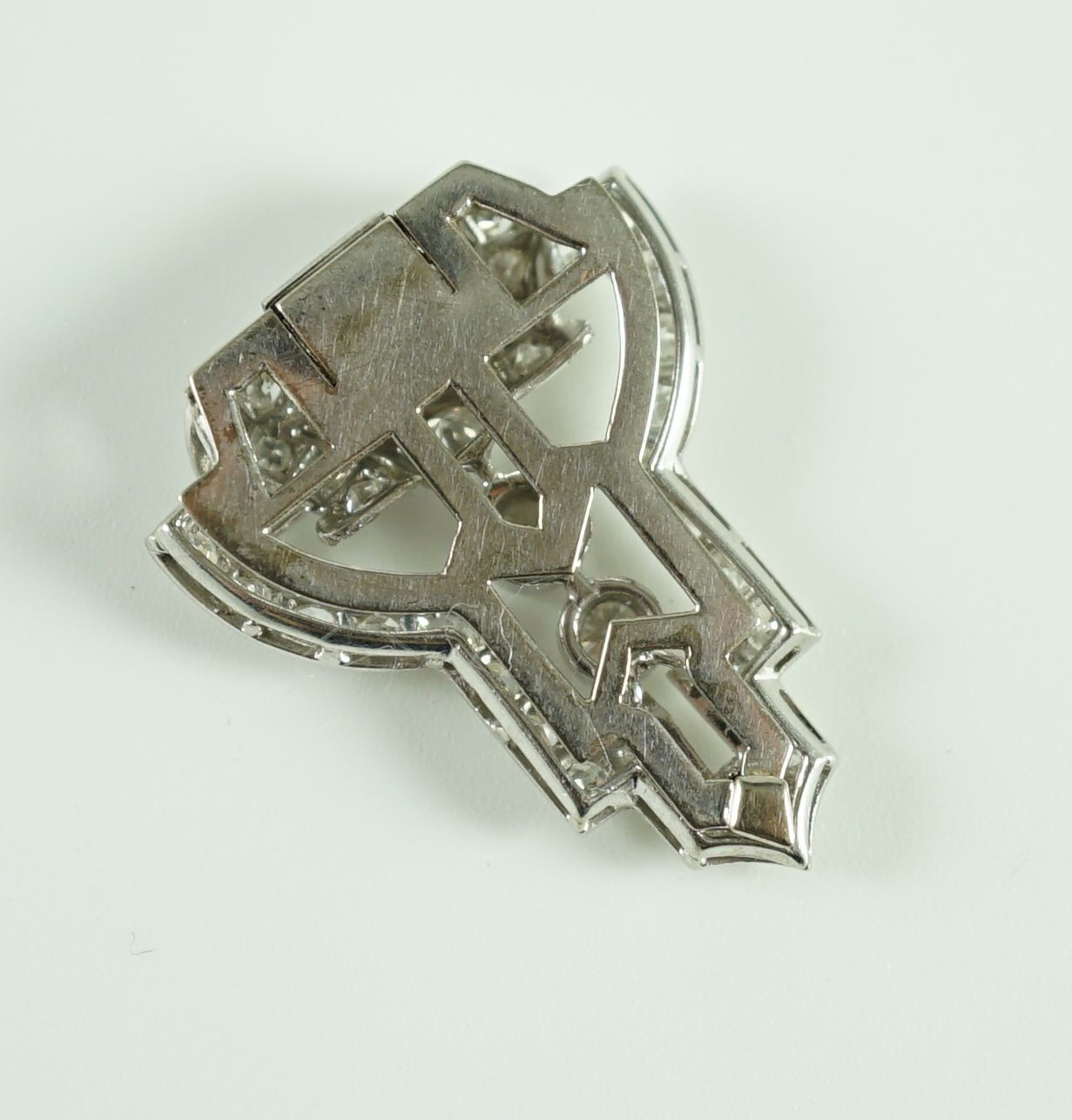 A 1930's Art Deco white gold and diamond cluster openwork clip brooch